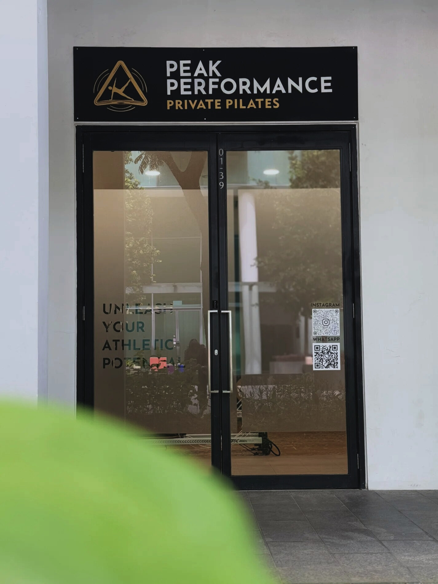 The Peak Performance studio entrance at 9 One-North Gateway