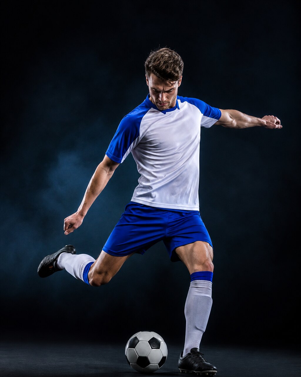 Footballer striking the ball